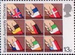 Direct Elections to European Assembly 13p Stamp (1979) Placing flags of member nations into ballot boxes